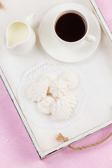 Homemade zephyr and coffe on wooden tray