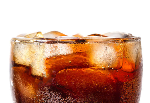 Cola in glass with ice on white background