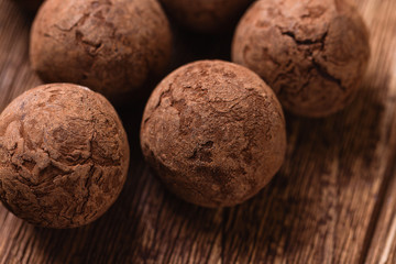 Chocolate truffles on wooden background