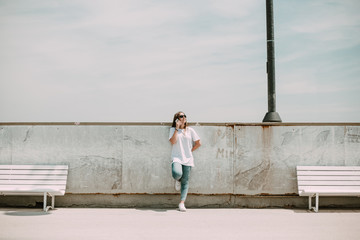 Beautiful woman using the mobile on the beach