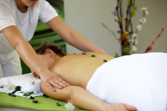 A young woman lying in a health spa
