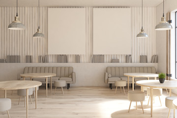 Cafe with round tables, posters, shelves