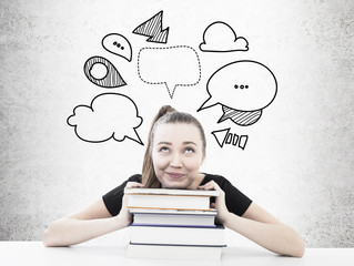 Dreamy student with a pile of books speech bubbles