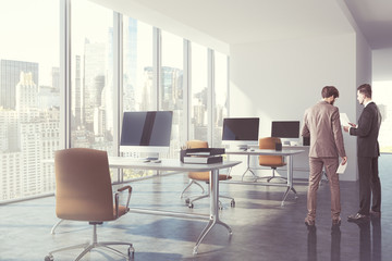 Businessmen in modern office toned