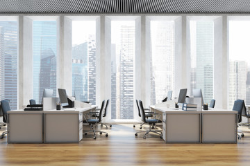 Workplace in an open space office close up