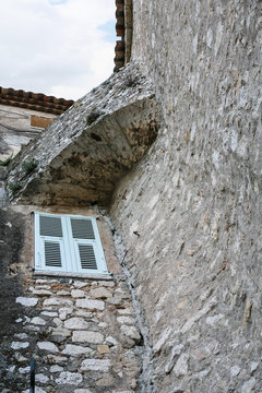 window in wall of medieval house in town Eze
