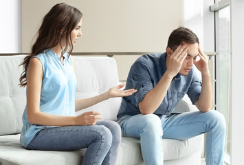 Young couple arguing at home