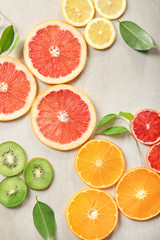 Fototapeta na wymiar Citrus slices on light background