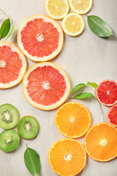 Citrus slices on light background