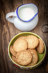 Stack of freshly baked oat biscuits in a bowl.