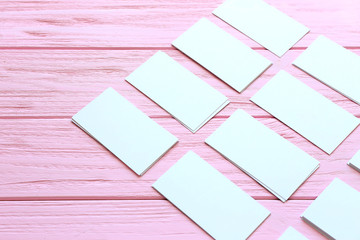 Blank business cards on color wooden background