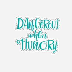 Dangerous when hungry - Hand drawn lettering quote in patch style. Vector illustration.