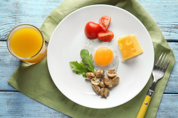 Tasty breakfast with egg on plate