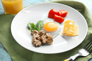 Tasty breakfast with egg on plate