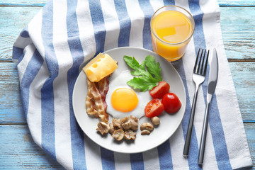 Tasty breakfast with egg on plate