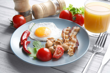 Tasty breakfast with egg on plate