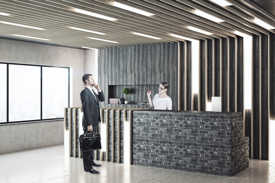 Reception desk with worker and client