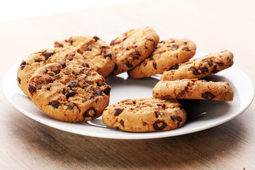 Chocolate cookies on wooden table. Chocolate chip cookies shot