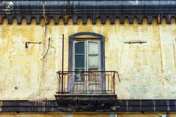 Fototapeta na wymiar Picturesque old traditional window and balcony in Italy, Italian style of architecture