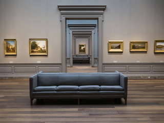 Symmetric view of a museum room looking through multiple doors