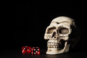 Skull and red dice