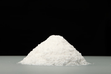 Salt/  A handful of salt on the table. Cooking salt