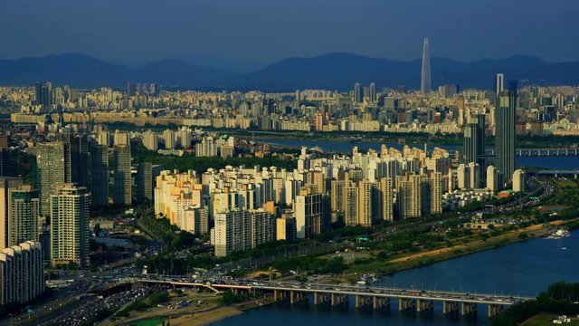 Aerial shot of city Seoul and Lotte world mall with traffic highway , South Korea 