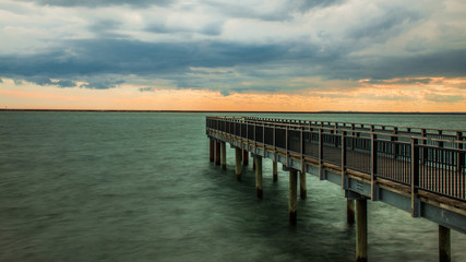 Obraz premium Pier Under Heavy Clouds