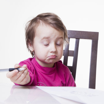 Office work. Little baby girl works with documents. Business concept (Humorous Photo)