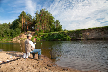 Fishing on the river in a rural place on a summer day