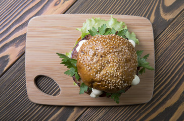 Burger cheese on wooden background