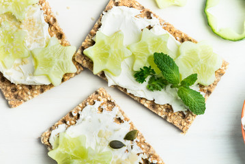 Snack from Wholegrain Rye Crispbread Crackers and Cucumber