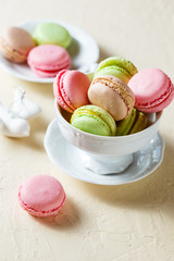 Colourful macaroons on the plates
