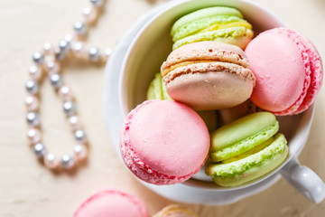 Colourful macaroons on the plates