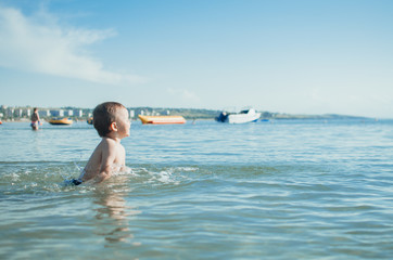 Little boy swimming in sea
