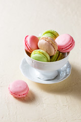 Colourful macaroons on the plates