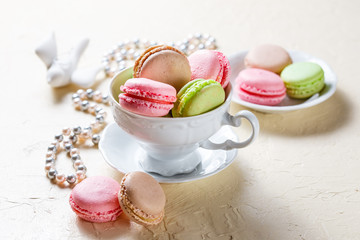 Colourful macaroons on the plates
