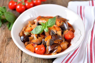 Eggplant stewed with mushroom, onion, cherry tomato, garlic and basil leaf. Rustic style.
