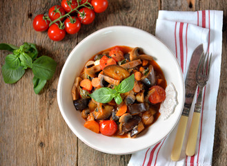 Eggplant stewed with mushroom, onion, cherry tomato, garlic and basil leaf. Rustic style.