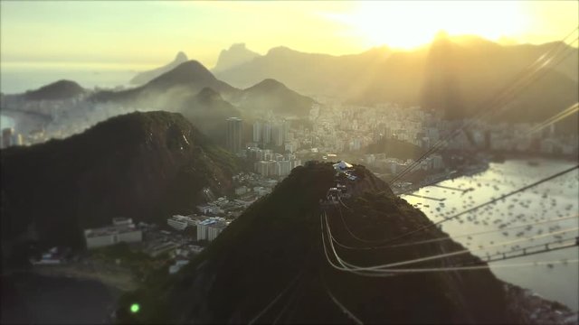 Timelapse view of mist moving across the Rio de Janeiro skyline under golden sunset