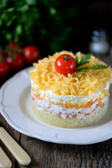 Traditional Russian salad of smoked chicken breast, boiled potatoes, carrots, eggs, onions, hard cheese and mayonnaise.