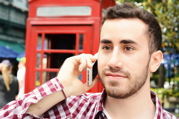 Latin man talking on the phone.