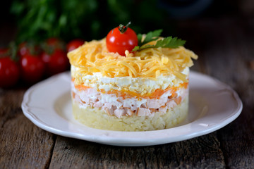 Traditional Russian salad of smoked chicken breast, boiled potatoes, carrots, eggs, onions, hard cheese and mayonnaise.