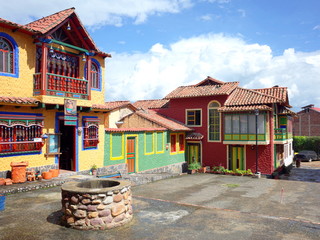 Obraz premium A pretty street in Pueblito Boyacense, every street represents a different village in the Colombian department of Boyaca