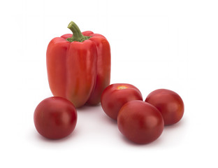 Red peppers and tomatoes on a white background