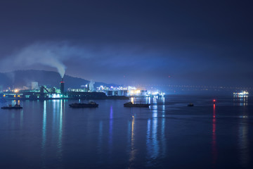 Naklejka na ściany i meble Industrial area of Incheon, Korea. Night view from sea