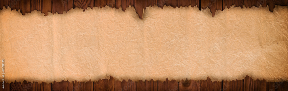 Poster open ancient scroll on a wooden table, panoramic paper background