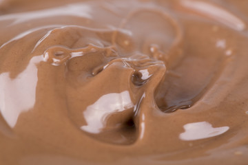 Smooth melted creamy chocolate background.