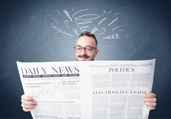 Businessman reading newspaper