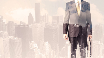 Handsome business man with overlay cityscape
